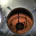 Brewer Brad looking into the 6000 gallon MDV brew kettle at the Stevens Point Brewery.